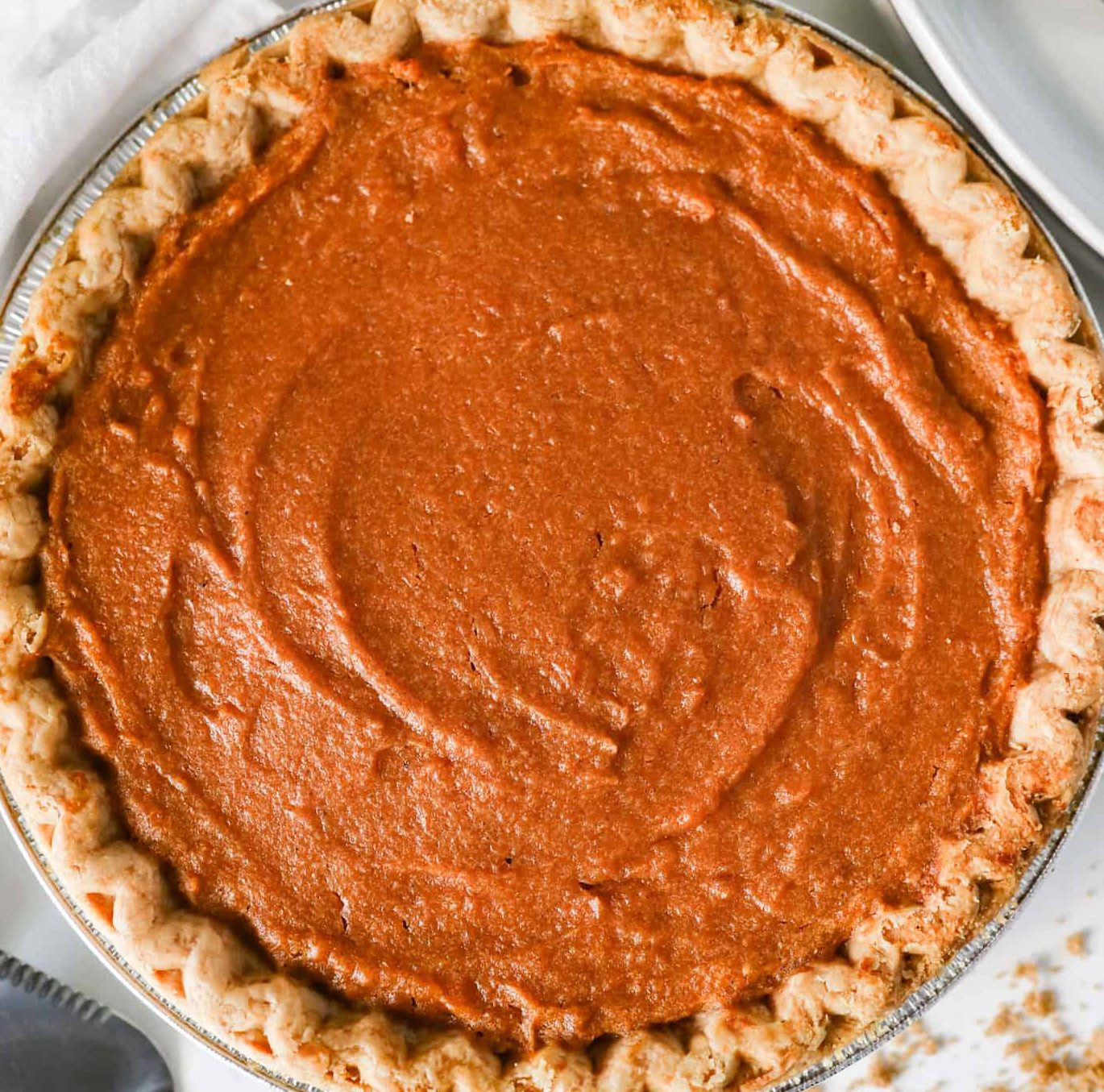 creamy maple sweet potato pie with golden crust and whipped cream